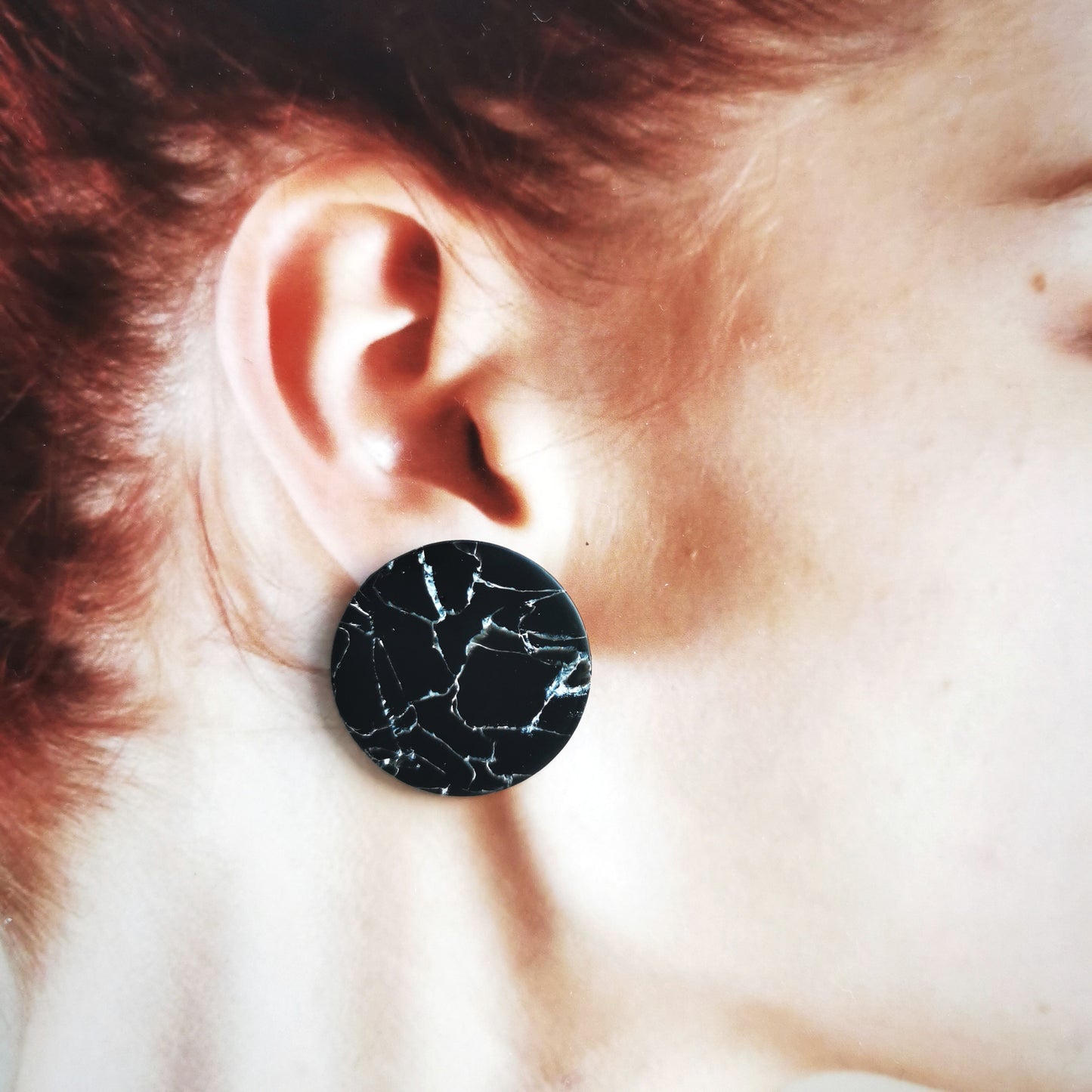 Minimal black marble stud.